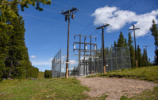 A substation in a rural, mountainous area.
